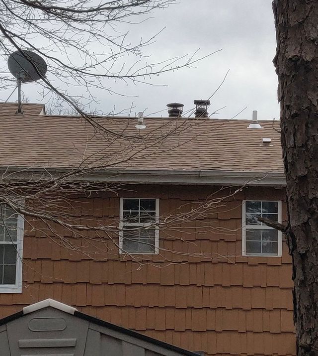 A house with a satellite dish on the roof