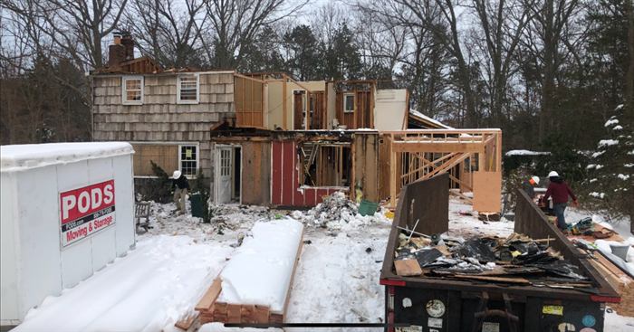 Before: the home gutted to the framing during demolition