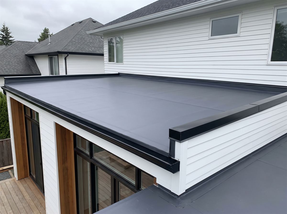 New EPDM flat roof with clean drip edge on a residential addition
